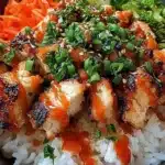 Delicious Bang Bang Chicken served with creamy sauce and garnished.