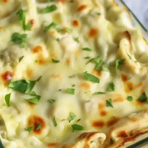 High Protein Chicken Alfredo Lasagna with creamy sauce and chicken, perfect for meal prep.