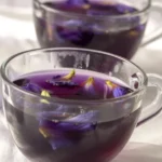 A refreshing natural Mounjaro drink made with lemon, honey, ginger, and water.