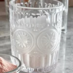 A refreshing pink salt diet recipe with Himalayan salt, lemon, and water for weight loss.
