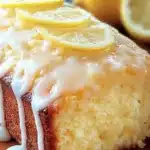 Slice of Starbucks copycat lemon loaf on a wooden board
