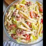 A vibrant bowl of Italian Grinder Pasta Salad featuring colorful vegetables and pasta.