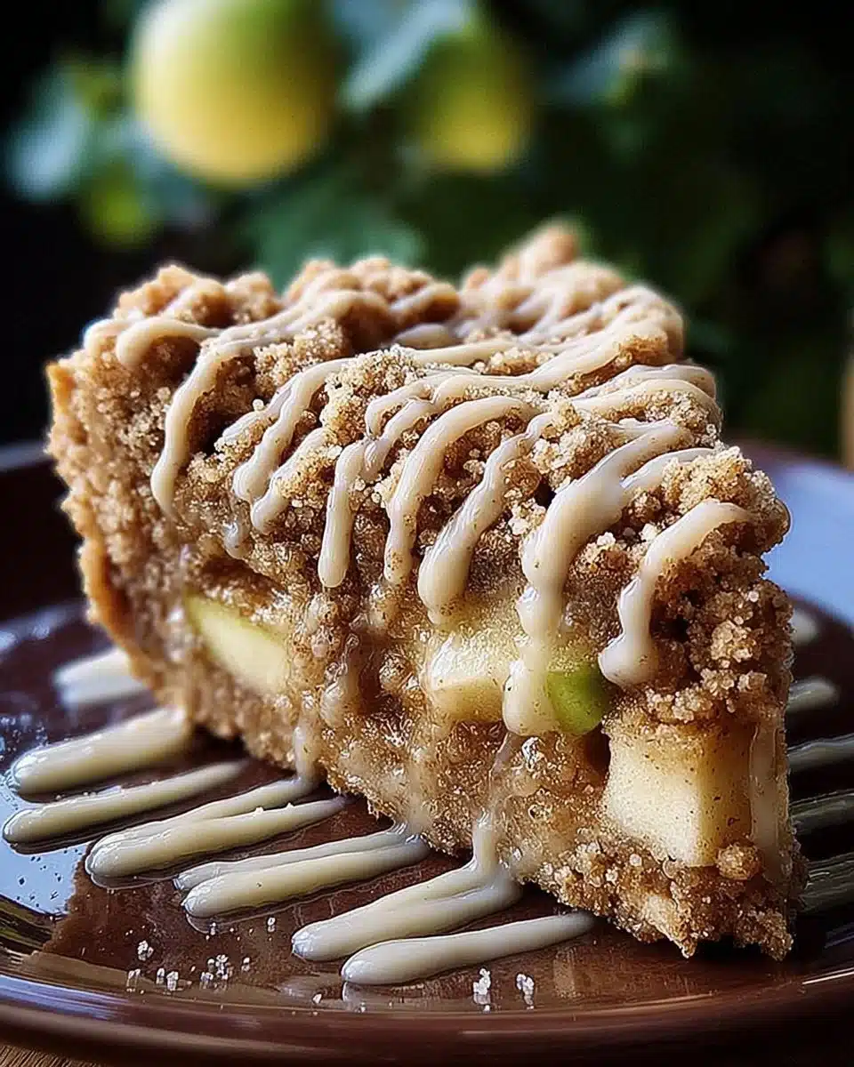 Slice of Apple Crumb Cake topped with cinnamon apple drizzle