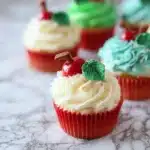 Freshly baked apple cupcakes topped with creamy frosting