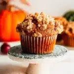Freshly baked apple pumpkin streusel muffins on a wooden table