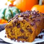Delicious chocolate chip pumpkin bread on a wooden cutting board