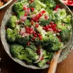 Colorful Broccoli Pomegranate Salad topped with fresh ingredients.