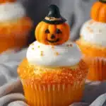 Creamsicle Mini Halloween Cupcakes decorated with fun Halloween-themed toppings