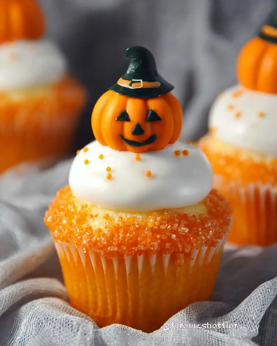 Creamsicle Mini Halloween Cupcakes decorated with fun Halloween-themed toppings