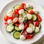 Fresh Cucumber Caprese Salad with cucumbers, mozzarella, tomatoes, and basil