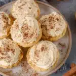 Healthy pumpkin cheesecakes topped with whipped cream on a dessert plate