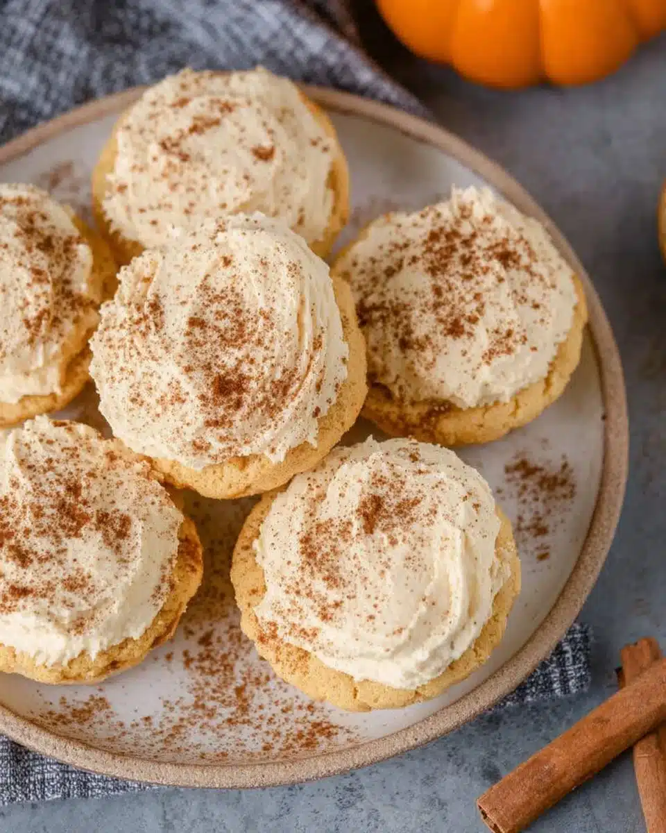 Healthy pumpkin cheesecakes topped with whipped cream on a dessert plate
