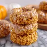 Pumpkin Rice Krispie Donuts topped with fall spices