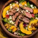Steak and squash salad with fresh greens and dressing