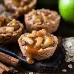 Apple Crisp Cookie Cups baked and garnished with cinnamon and apple slices.