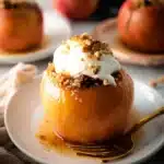 Delicious baked apples with cinnamon and sugar, a warm dessert option.