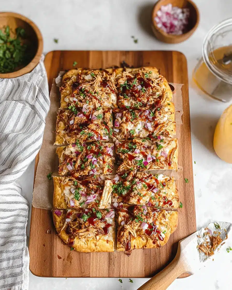 Delicious BBQ chicken flatbread pizza topped with cheese and cilantro