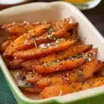 Plate of best honey glazed carrots with a shiny glaze