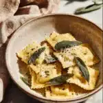 Delicious homemade butternut squash ravioli served with sage butter sauce