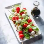Delicious Caprese Skewers with mozzarella, tomatoes, and basil on display.
