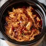 Crockpot BBQ Pulled Chicken served with coleslaw and buns