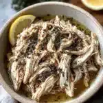 Delicious Crockpot Greek Chicken Gyros served with fresh toppings