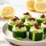 Easy avocado appetizers featuring goat cheese and cucumber bites