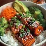 High protein low calorie teriyaki salmon bowl with vegetables and rice