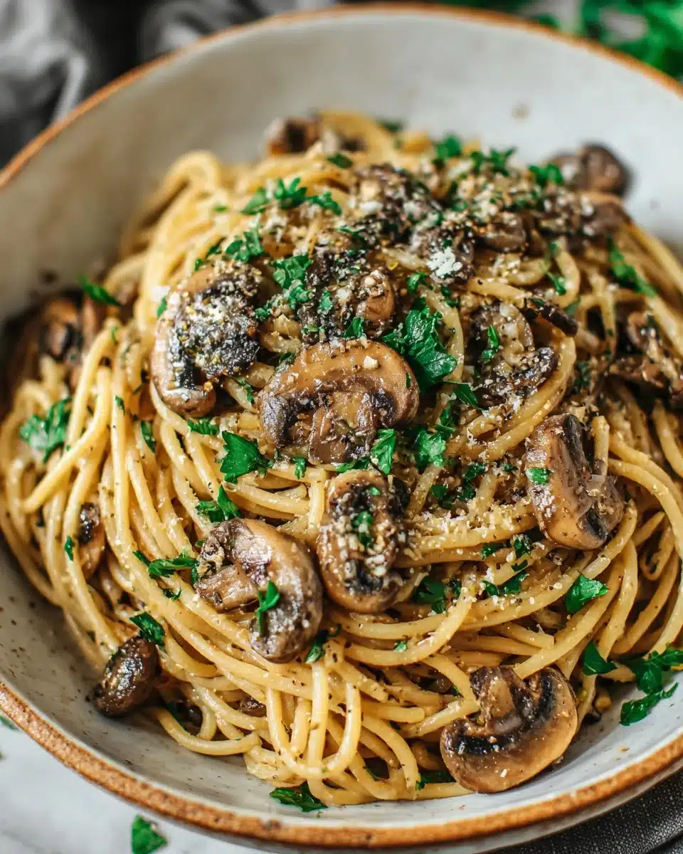 Delicious Mushroom Garlic Butter Pasta garnished with fresh herbs