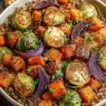 A colorful Roasted Winter Vegetable Nourish Bowl filled with seasonal veggies and grains.