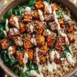 Sweet Potato Tahini Bowl topped with fresh vegetables.