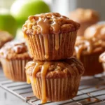 Delicious caramel apple muffins topped with sweet caramel drizzles.