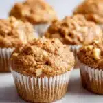 Healthy cinnamon apple oatmeal muffins in a basket