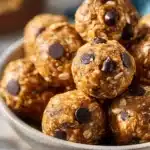 Delicious no bake energy bites made with oats, nuts, and chocolate chips.