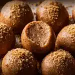 Nutritious Biscoff cheesecake protein balls presented on a wooden plate