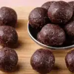 No bake brownie batter protein balls in a bowl, a delicious healthy snack.