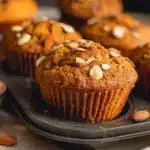 Delicious Pumpkin Almond Flour Muffins sitting on a wooden table