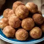 Homemade snickerdoodle energy balls with cinnamon and sugar coating