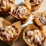 Delicious sourdough coffee cake muffins topped with a crumbly streusel.