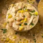 Bowl of creamy White Chicken Chili garnished with cilantro and jalapeños
