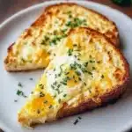 Delicious cheesy egg toast served on a rustic plate