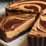 Delicious Chocolate Peanut Butter Swirl Pie with creamy filling and rich chocolate topping.