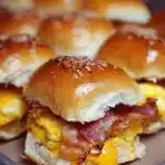 Bacon, egg, and cheese breakfast sliders on a plate