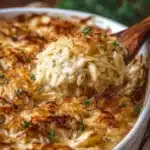 Delicious French Onion Chicken Orzo Casserole baked in a creamy sauce with cheese.