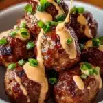 Korean BBQ meatballs served on a platter with dipping sauces