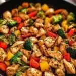Quick and healthy chicken skillet dish with colorful vegetables and herbs