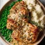 Creamy and flavorful Boursin Chicken served with herbs and vegetables
