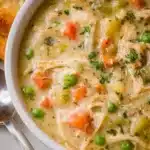 Delicious Chicken Pot Pie Soup served in a bowl with fresh herbs