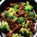 Delicious crock pot beef and broccoli served on a plate, showcasing tender beef and fresh broccoli.