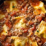 Delicious Crockpot Ravioli Lasagna layered with cheese and sauce